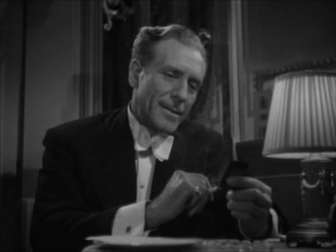 Sir George lights Lydia's cigarette.