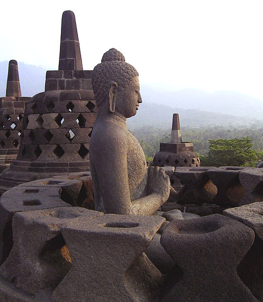 A Buddha statue from Borobudur, with a hand position symbolizing the turning of the wheel of fate.